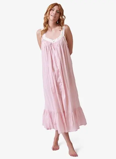 Red haired model wearing pink cotton nightdress